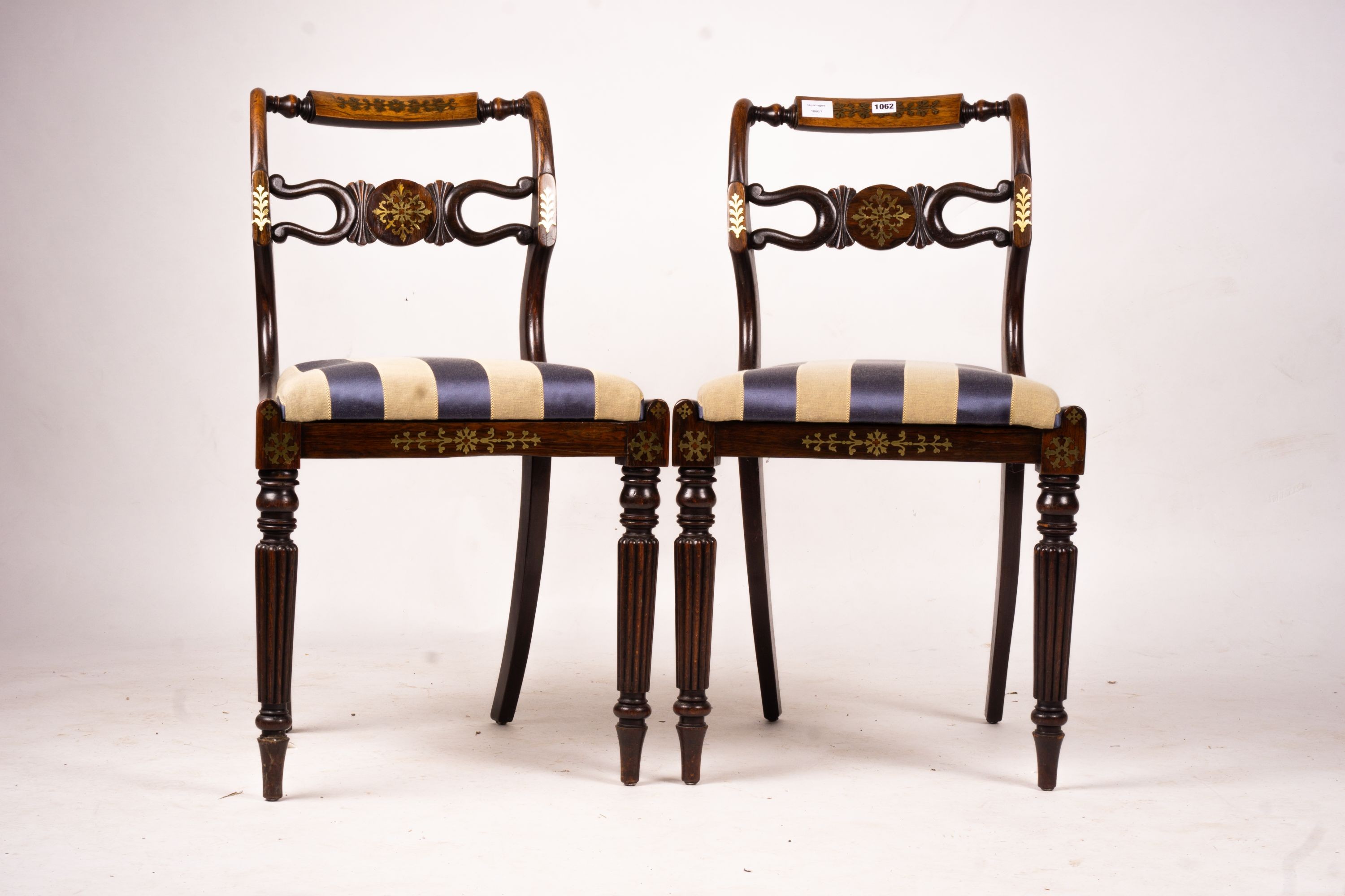 A set of six Regency brass inset simulated rosewood dining chairs